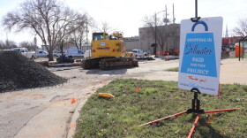 A sign that reads "Shopping in Stillwater paid for this project" stands in the grass next to an active reconstruction project on 7th street, across the road from city hall, Feb. 28, in Stillwater, Oklahoma.