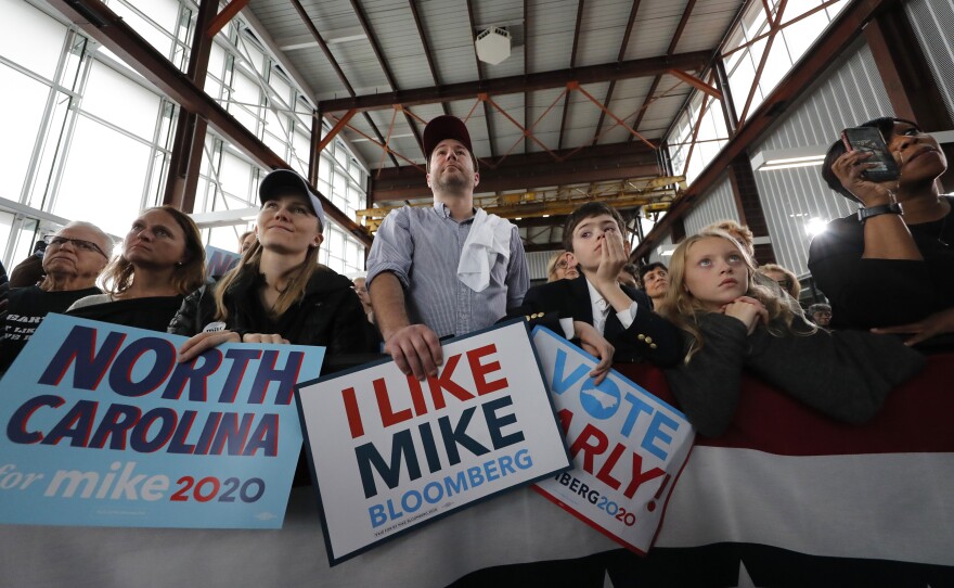 People listen as Mike Bloomberg speaks at a campaign event in Raleigh, N.C., Thursday.