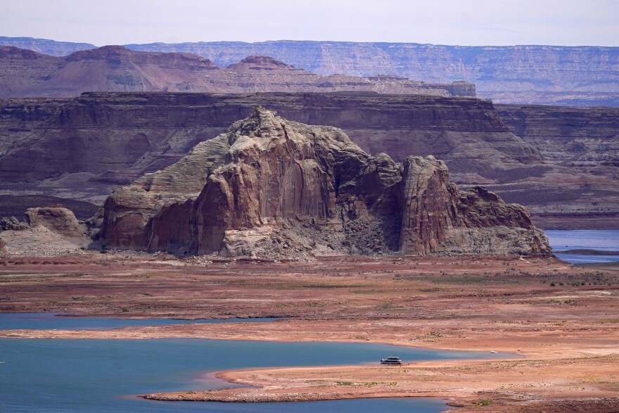 FILE - Low water levels at Wahweap Bay at Lake Powell along the Upper Colorado River Basin are pictured, June 9, 2021, at the Utah and Arizona border at Wahweap, Ariz. In a vote on Thursday, May 23, 2024, the Navajo Nation Council has unanimously approved a proposed water rights settlement that carries a price tag larger than any such agreement enacted by Congress. (AP Photo/Ross D. Franklin, File)