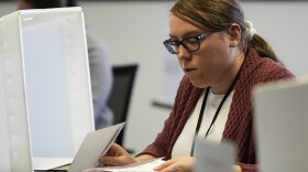 FILE - Elections assistant Mikayla Riley works in the processing center during early voting, Feb. 21, 2024, in Raleigh, N.C. (AP Photo/Mike Stewart, File)