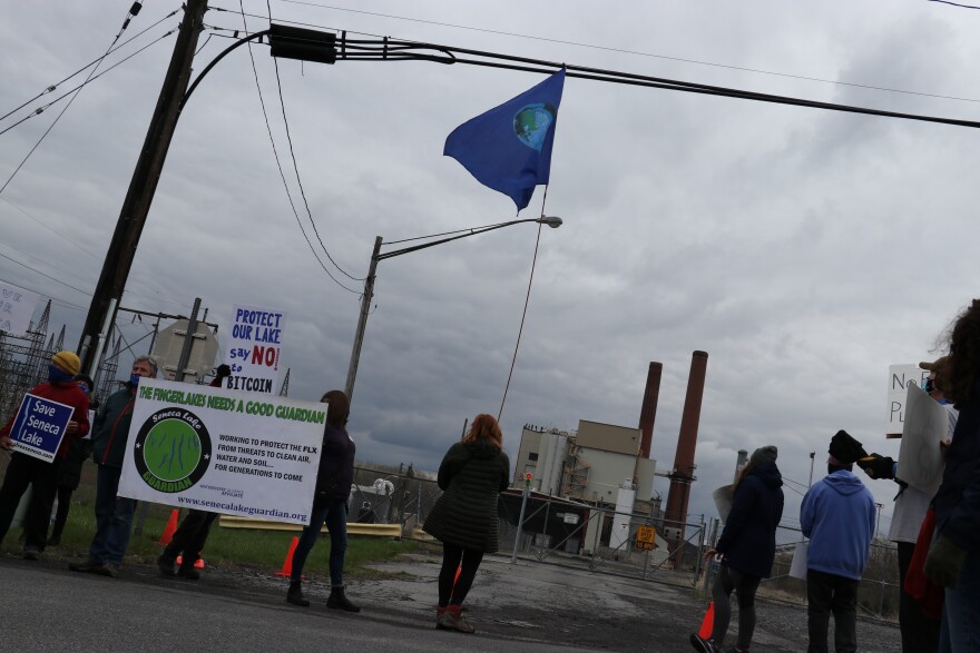 Yvonne Taylor and other protestors gather outside the Greenidge Generation Facility in Torrey, NY in April before the facility's Bitcoin mining expansion was approved. (Vaughn Golden/WSKG)