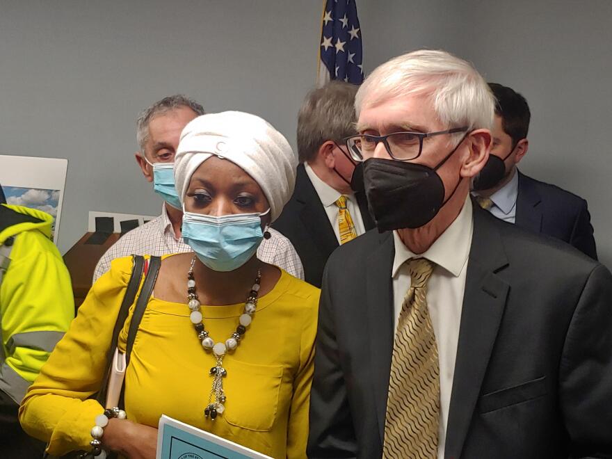 Kenosha community activist Porche Bennett-Bey speaks to Wisconsin Gov. Tony Evers, after Thursday's news conference.