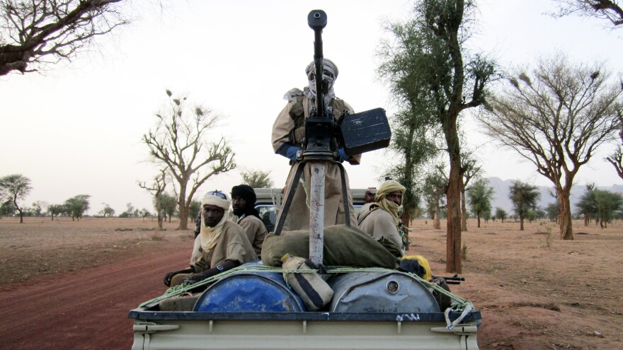 Militiaman from the Ansar Dine radical Islamic group ride on an armed vehicle between Gao and Kidal in northeastern Mali in June. Jihadists currently control the country's north.