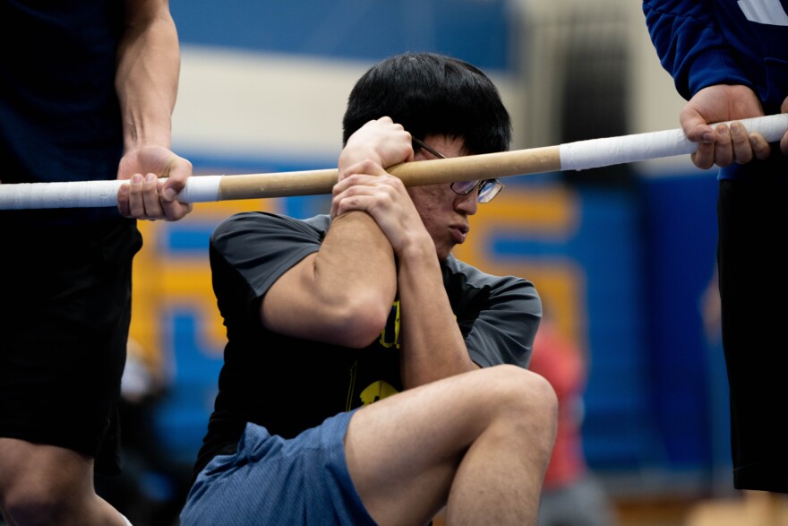 A student competes in the Wrist Carry at the NYO Bethel Invitational at Bethel Regional High School on March 31, 2023.