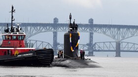 The Virginia-class submarine USS Minnesota (SSN 783) heads up the Thames River toward Naval Submarine Base New London in Groton.