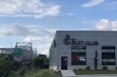 The exterior side of The Putt Club venue in East Peoria is shown with the Murray Baker Bridge in the background.   