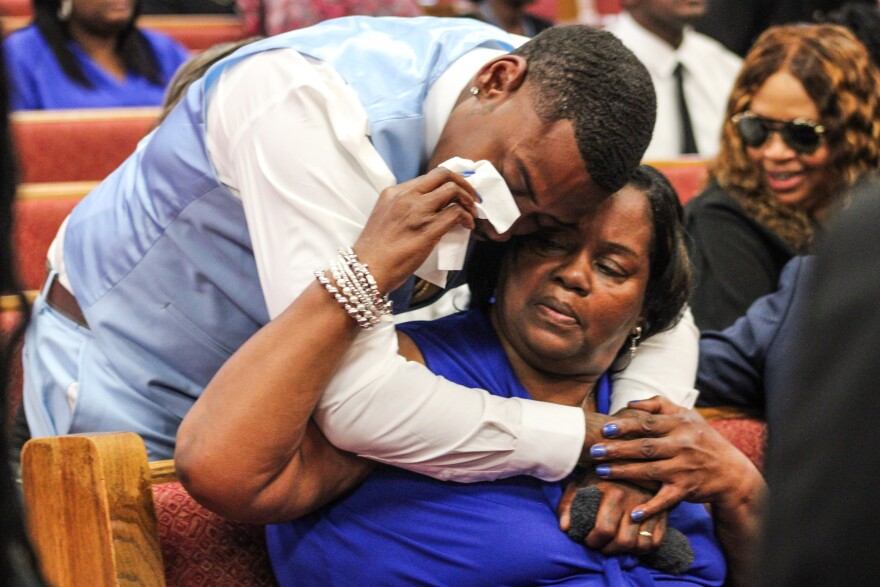 Cynthia Gilmore sits in the front row of her son’s funeral at Cornerstone Baptist Church in Sikeston, Missouri. Lloyd Gilmore died in police custody on June 10. (Cara Anthony/KFF Health News)