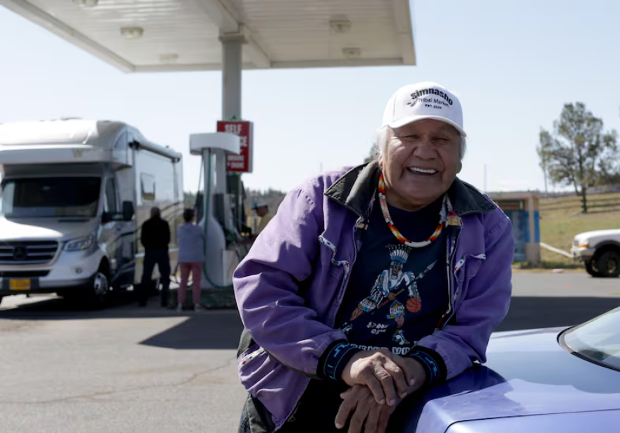 Delson Suppah Sr., an elder and member of the Confederated Tribes of Warm Springs leans on his car.
