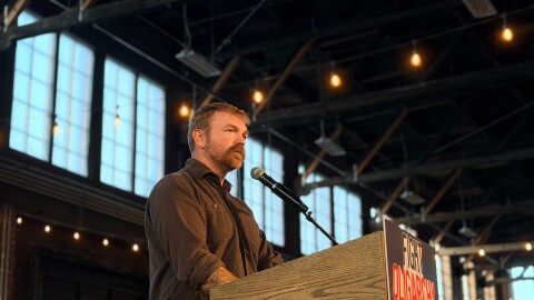 Graham Platner addresses a crowd at a rally in Portland on Memorial Day.