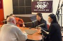WSIU's Jeff Williams (back to camera) interviews (left to right) Bo Chen, program director with Guangdong Radio-TV in China, Yu Chen, a documentary director and Pan Chenhong, director of the Division of Chinese Media Convergence with Guangdong Radio-TV.
