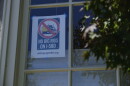 A “NO BIG RIGS ON I-580” poster hangs in the front window of Susan Gallardo’s home in Oakland’s Crocker Highlands neighborhood.