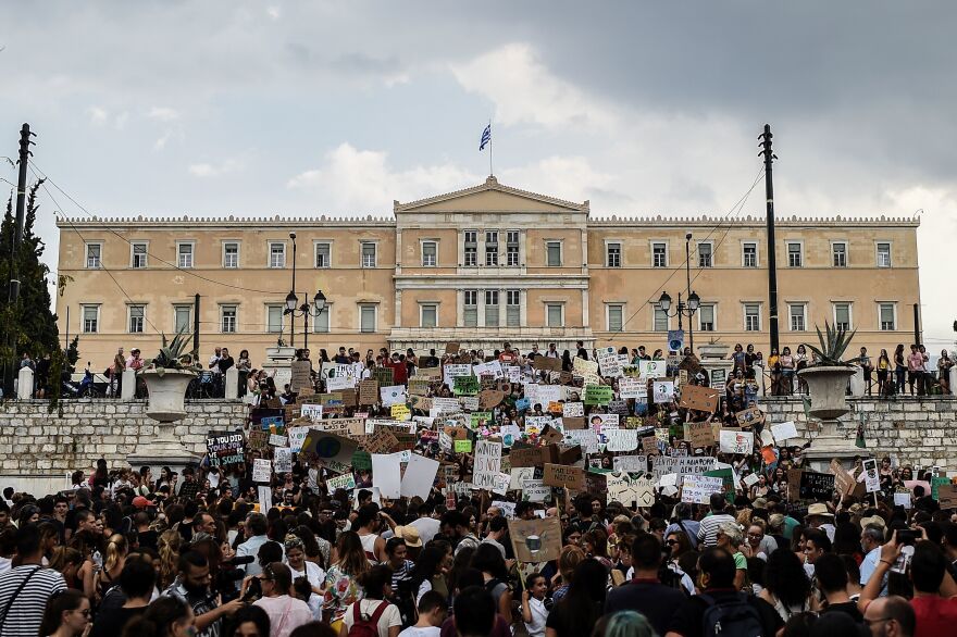 People take part in a demonstration in front of the Greek Parliament in Athens.