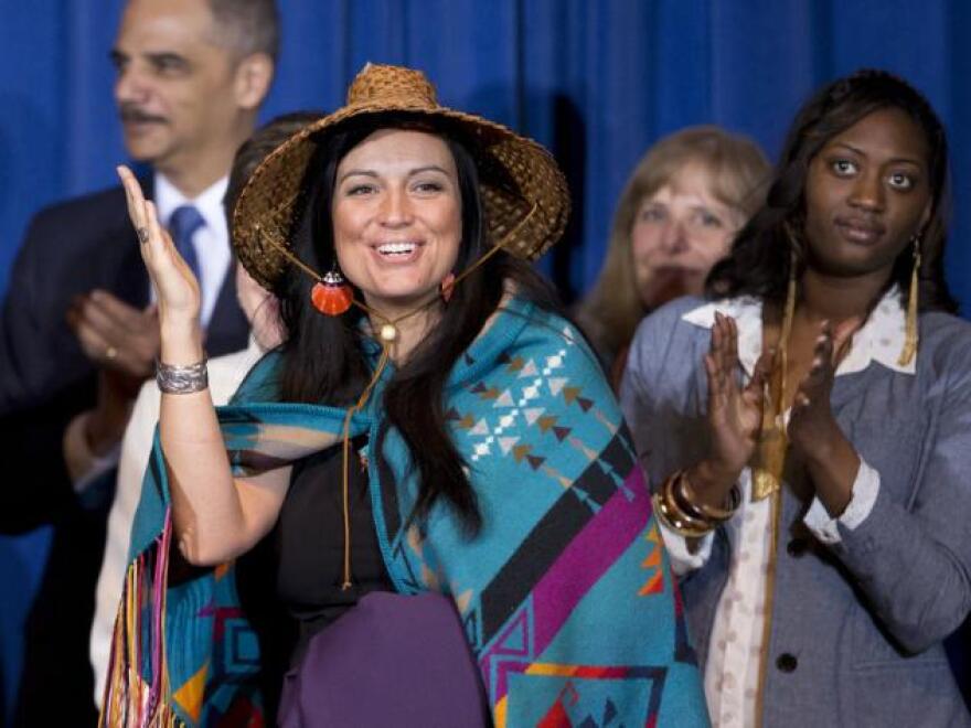 Deborah Parker, vice chair of the Tulalip Tribes of Washington state, reacts to President Barack Obama signing the Violence Against Women Act in 2013 in Washington.