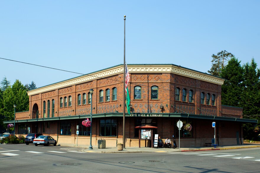 A red brick municipal building in a small town.