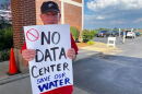 Charles Cross stands outside an open house about data centers in St. Charles, Missouri, on Aug. 13, 2026. Cross lives near the site of a proposed data center in St. Charles and does not want to see it built.