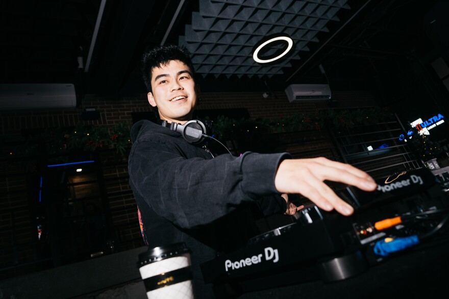 ZAVYN, a St. Charles-based DJ, performs during a Sunday House Club coffeeshop meetup on Sunday, Dec. 7, 2025, at Bevo Caffe Lounge in St. Louis’ Bevo Mill neighborhood.