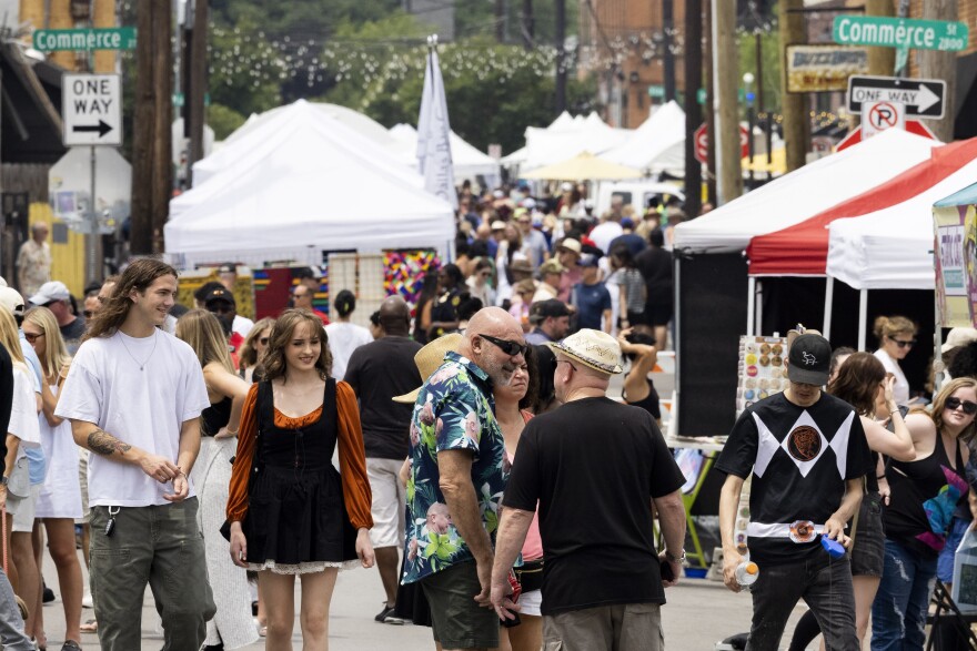 People look around during the Deep Ellum Community Art Fair. 