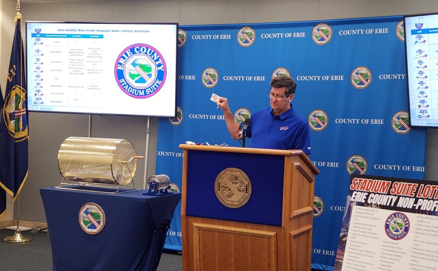 Erie County Executive Mark Poloncarz draws names of local non profits to be awarded suite tickets to Buffalo Bills home games.
