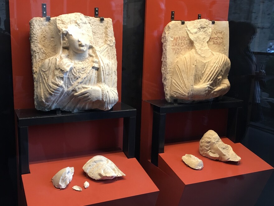 Two ancient marble busts, damaged during ISIS's occupation of the ancient site of Palmyra in Syria, are included in the exhibition.