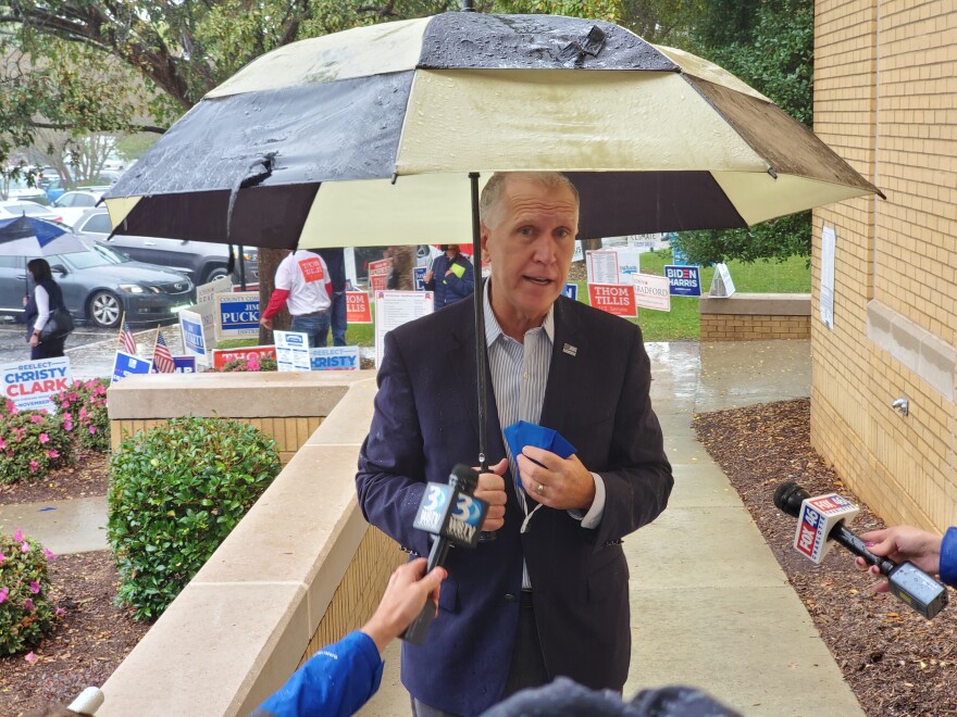 Thom Tillis speaks to reporters Wednesday after dropping off his mail ballot in Cornelius.