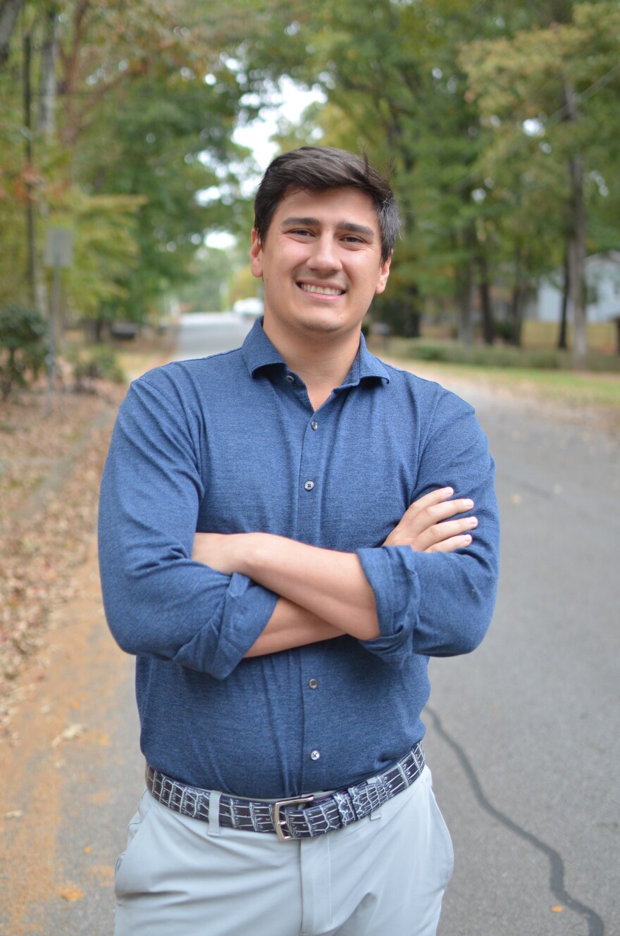 A man standing for a portrait.