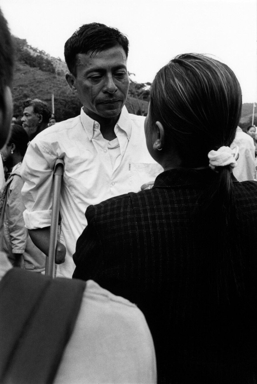 Friends bid farewell to Myo Myint before he leaves Umpiem Mai refugee camp for the last time.