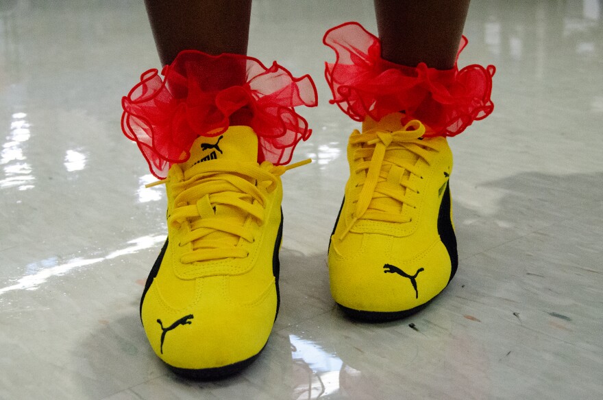 Azyia Chatmon, a sophomore at Central High, designed this year's back-to-school outfit around a new pair of bright yellow PUMA Speedcats styled with red ruffled socks.