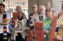 Clergy attending the United Church of Christ General Synod gathered outside of the Kansas City Convention Center in early July 2025 The group passed a resolution against the Trump administration’s tactics on immigration.