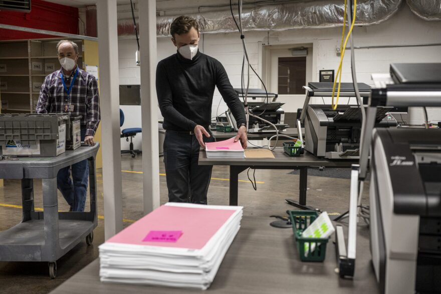 Election office employees put away sample ballots during the conclusion of a ballot counting demonstration at the Multnomah County Elections Office in Portland, Oregon on Tuesday, October 25th, 2022. Photo by Jordan Gale