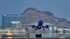 FILE - A jet takes flight as heat ripples radiate from the runway at Sky Harbor International Airport in Phoenix, on July 25, 2023. (AP Photo/Matt York, File)