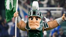 Sparty, the Michigan State mascot, runs out onto the field before the first half of an NCAA college football game against Penn State, Friday, Nov. 24, 2023, in Detroit. 