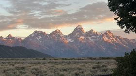 Mountains rise behind the plains.