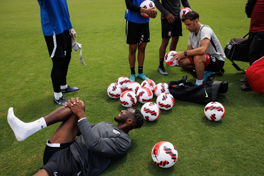 Sacramento Republic FC player Luther Archimede stretches after practice.