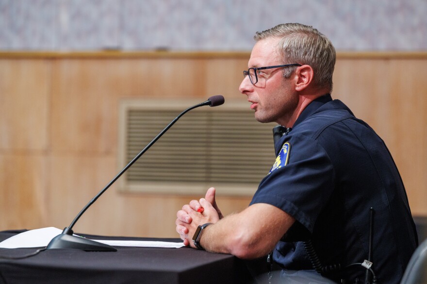 Lansing Police Chief Robert Backus speaks during a Lansing City Council meeting on Aug. 24, 2026.