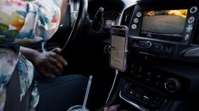 Jaquelyn “Jackie” King, a rideshare driver for the company Uber, backs out of a driveway in Gainesville, Fla., on Thursday, Nov. 20, 2025.