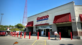 Entrance to the Costco store in Midtown Kansas City with a tall red broadcast tower and a butterfly