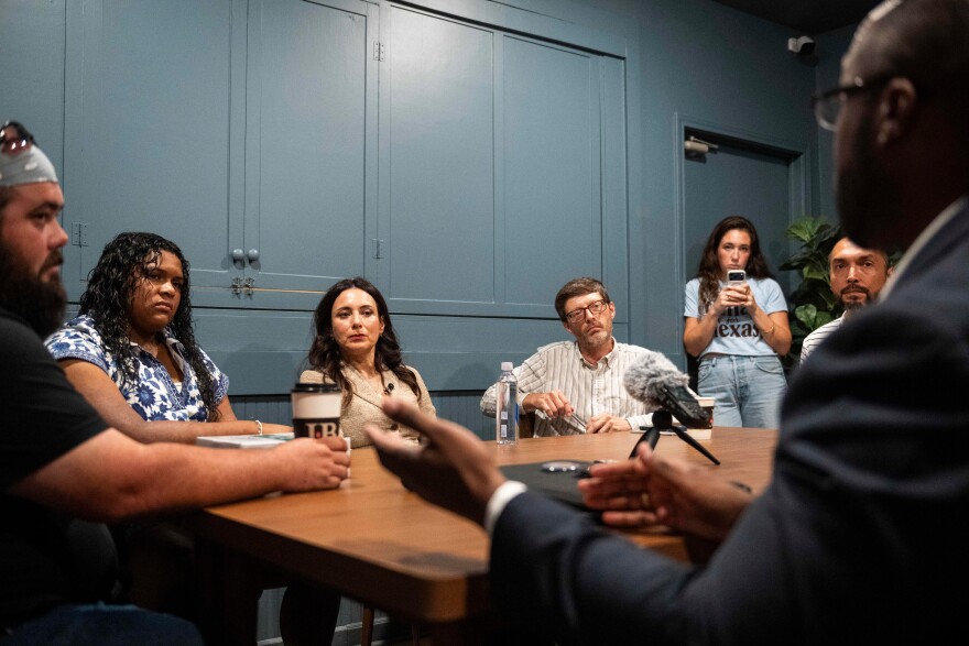 Democratic candidate for Texas governor Gina Hinojosa, third from the left, listens to Stephen Sanders, right, during a roundtable discussion on data centers, Saturday, July 18, 2026, in Lubbock, Texas.