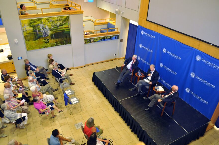 Former governor Bob Graham (left), Jon Mills (center) and David Hart (right) from the Florida Chamber of Commerce discuss how Amendment 1 would affect Florida in front of an audience at Pugh Hall Sept. 4. Graham, a supporter of the amendment, said Florida should be viewed as a treasure to be protected instead of a “commodity,” while Hart said that passing this amendment could cause some serious implications for balancing the state budget.