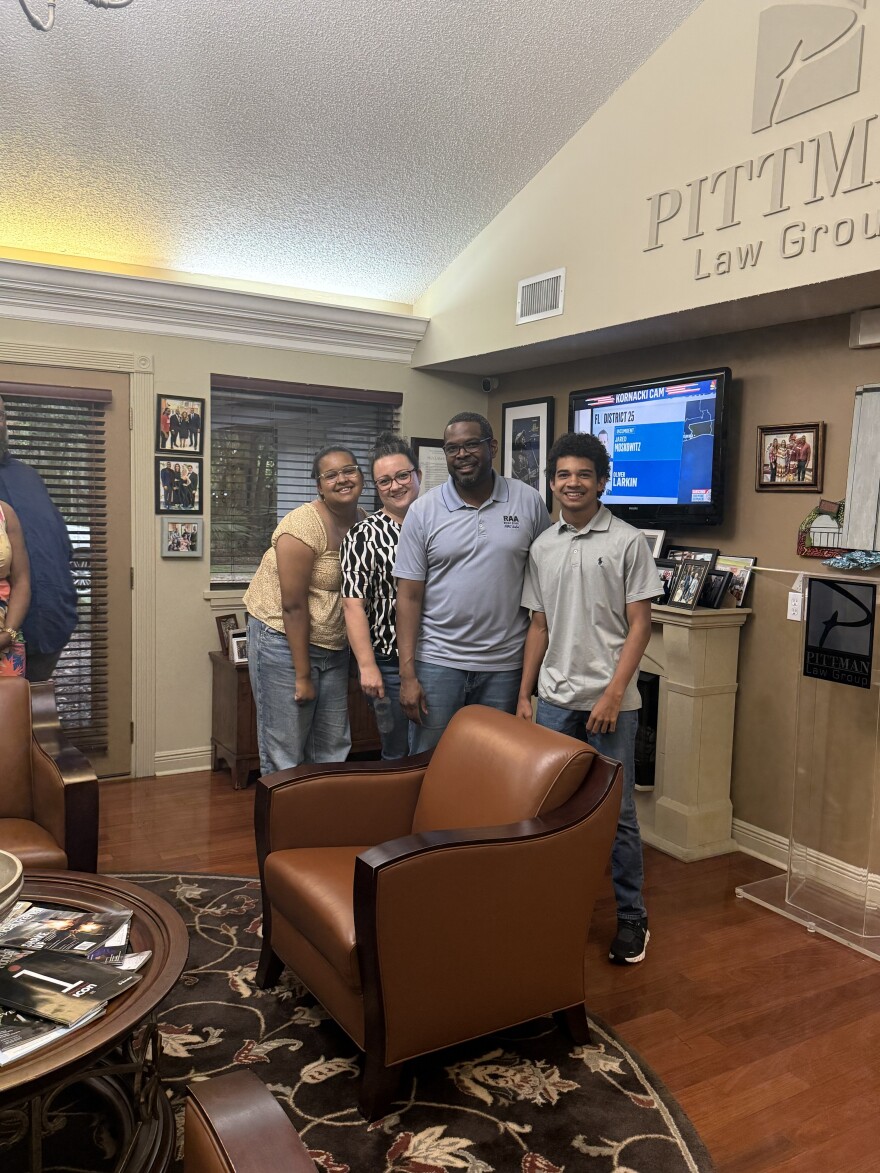 Marcus Nicolas, Leon County School Board District 5 incumbent, watched election results Aug. 18, 2026, with family, friends and colleagues during a watch party.