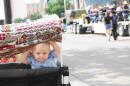 A baby watches the parade