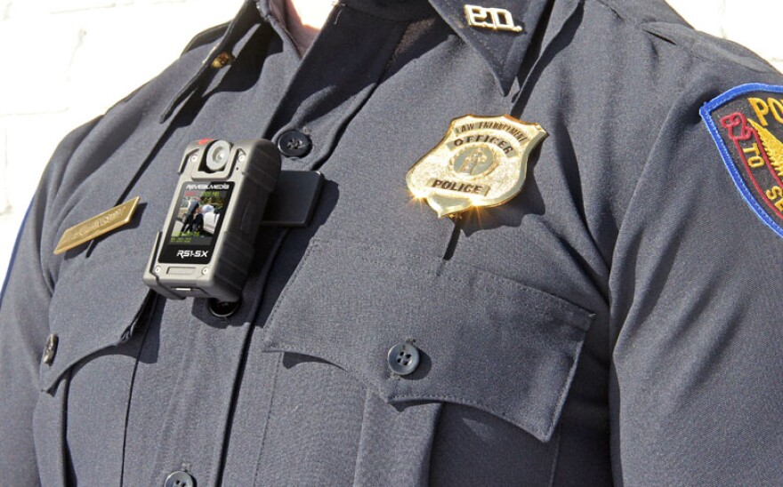 Photo: A camera pinned on a police uniform