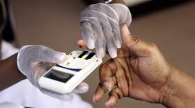 NEWARK, NJ - AUGUST 13: A mans finger is pricked to test his cholesterol at the City of Newark's free homeless health fair at the Department of Child and Family Well-Being on August 13, 2009 in Newark, New Jersey. The Department of Child and Family Well-Being in partnership with other health organizations gave free medical examinations to the homeless including screening for high blood pressure, cancer, and diabetes. (Photo by Rick Gershon/Getty Images)
