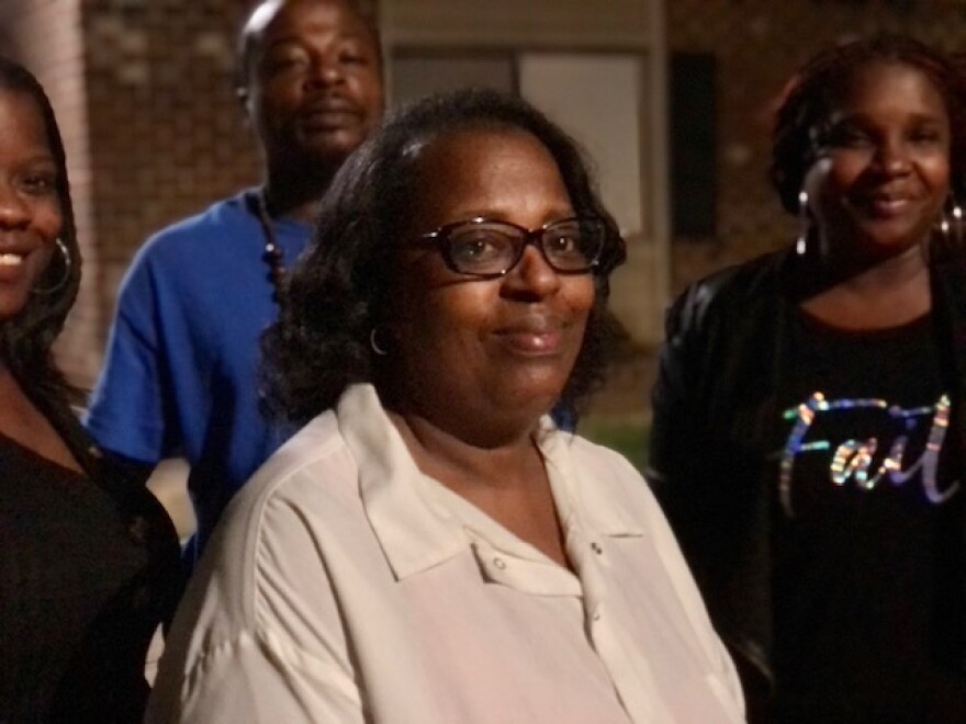 Betty Johnson and her family outside of her apartment in Raleigh. She is the mother of Curtis Mangum, who died in police custody three years ago.