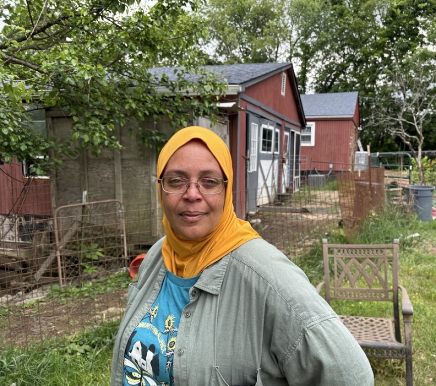 Farmer Kenya Abraham on her farm in front of the creamery.