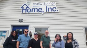 people stand outside a building, posing for the camera.  From left, Miles Taylor, Antioch College Student Miller Fellow (2025); Chris Hall, Program Manager; Emily Seibel, Executive Director; Tom McCaffrey, Client-First Specialist; Brittany Keller, Development Coordinator; Alexandra Scott, Outreach & Fundraising Manager.