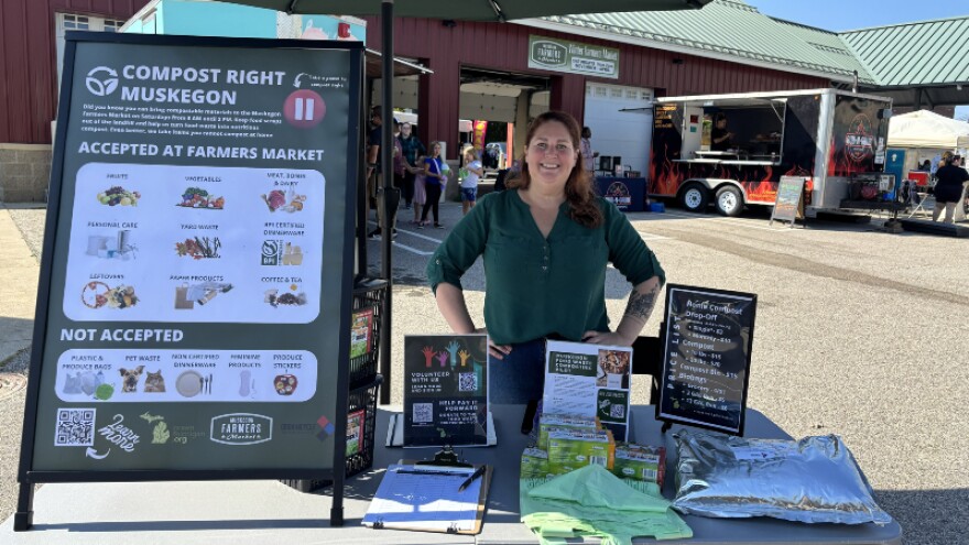 Green Michigan Executive Director Angela Fox at her composting booth at the Muskegon Farmers Market