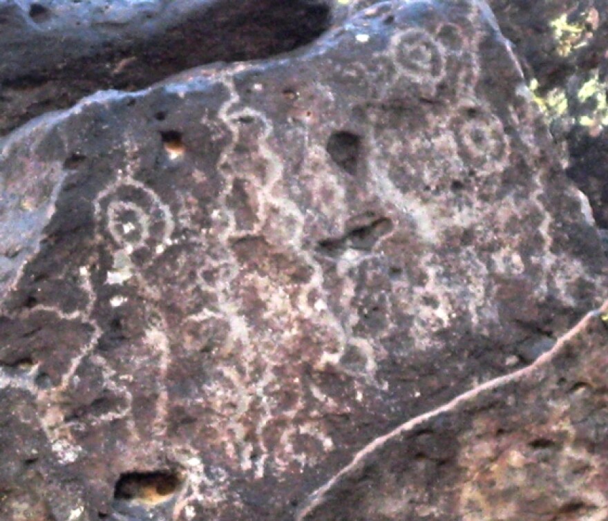 A panel of Archaic period petroglyphs with wavy lines and curvilinear forms, at the ASU SHESC Deer Valley Petroglyph Preserve.
