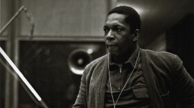 John Coltrane at the recording sessions for <em>A Love Supreme</em>. In addition to the images already published, photographer Chuck Stewart recently unearthed never-before-seen shots of the session, including this one. Per the request of Chuck Stewart's family, reproduction of these photos elsewhere is prohibited.