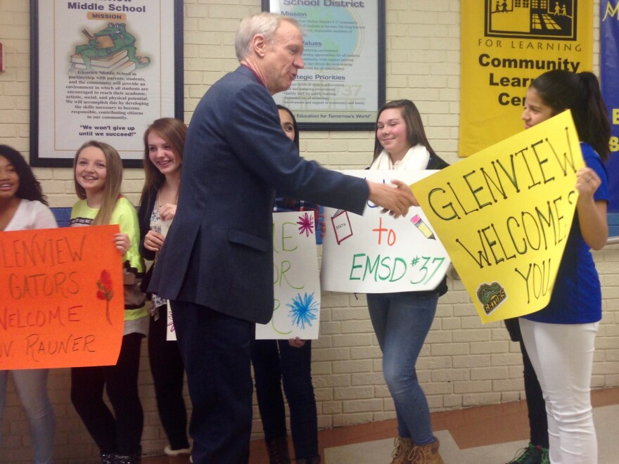 Governor Bruce Rauner greets students as he arrives at Glenview Middle School in East Moline. He visited the school to talk about the importance of education and reforming the funding formula.