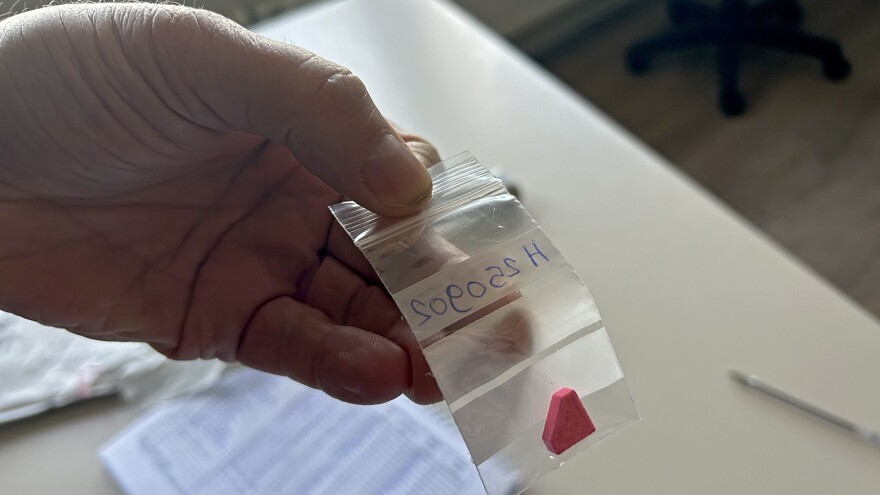 Daan van der Gouwe holds a pill submitted for analysis in the drug testing lab at Trimbos Institute in Utrecht, Netherlands, on Thursday, March 6, 2025. 